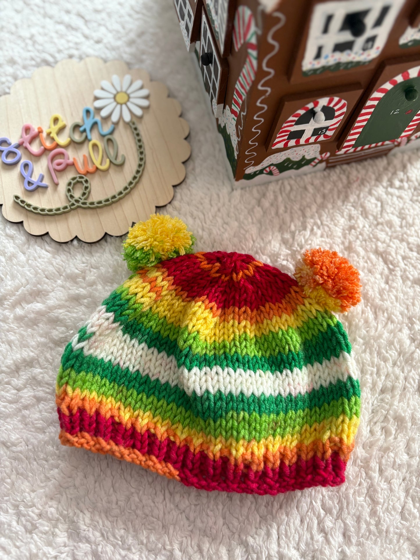 Personalisable knits - 12-18 months jungle colours hat with 2 pom poms