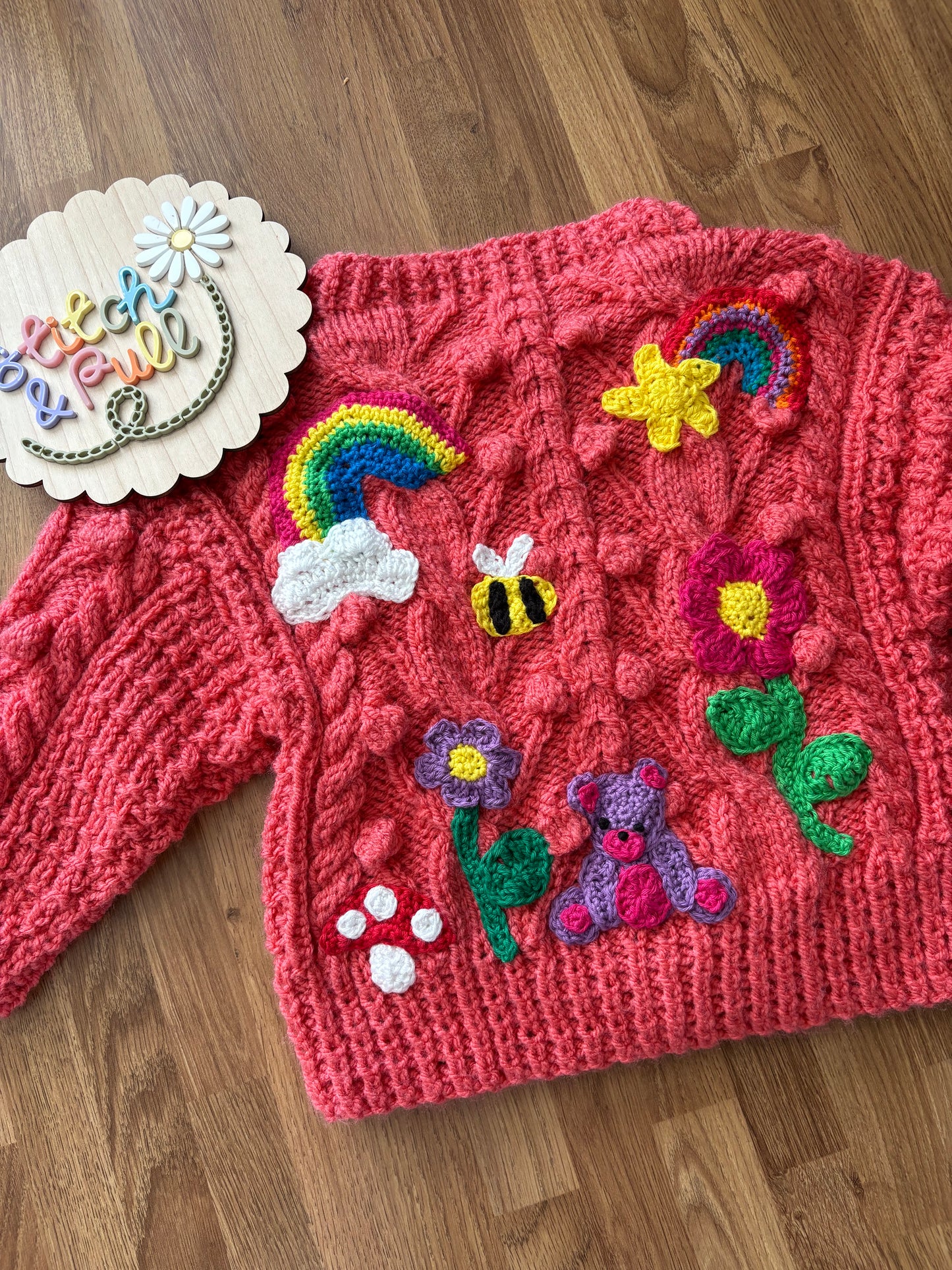 Pre-made Knitted Pink Popcorn Cardigan with flowers, rainbows, star, cloud, bee, mushroom and bear - Size 1-2 years