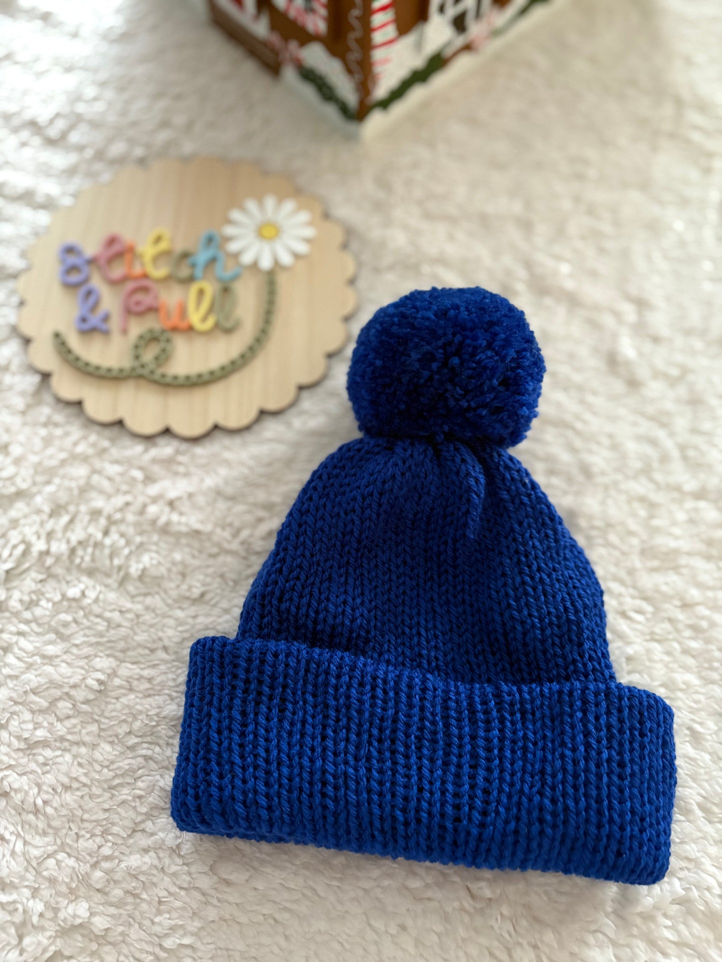 Personalisable knits - 12-18 months dark blue hat with pom pom