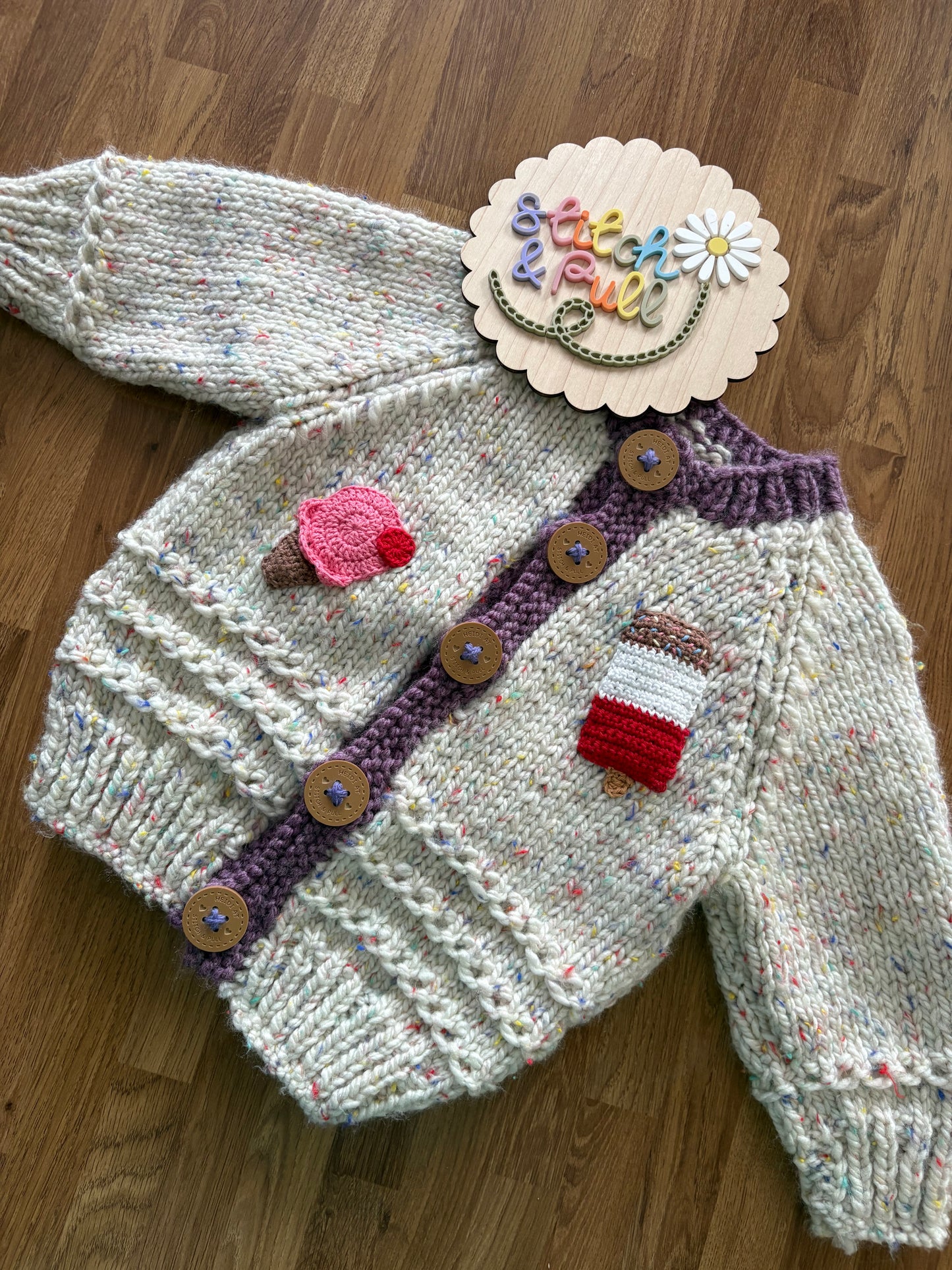 Pre-made Knitted Sprinkle Cream Cardigan with purple ribbing - Size 1-2 years