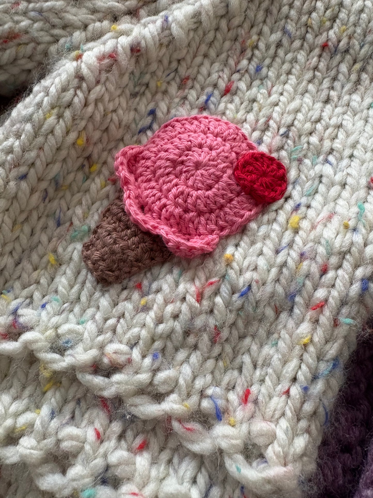 Pre-made Knitted Sprinkle Cream Cardigan with purple ribbing - Size 1-2 years