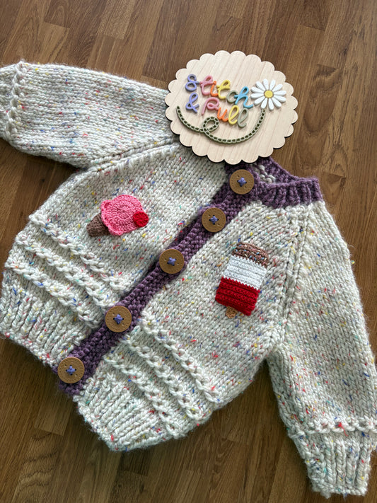 Pre-made Knitted Sprinkle Cream Cardigan with purple ribbing - Size 1-2 years