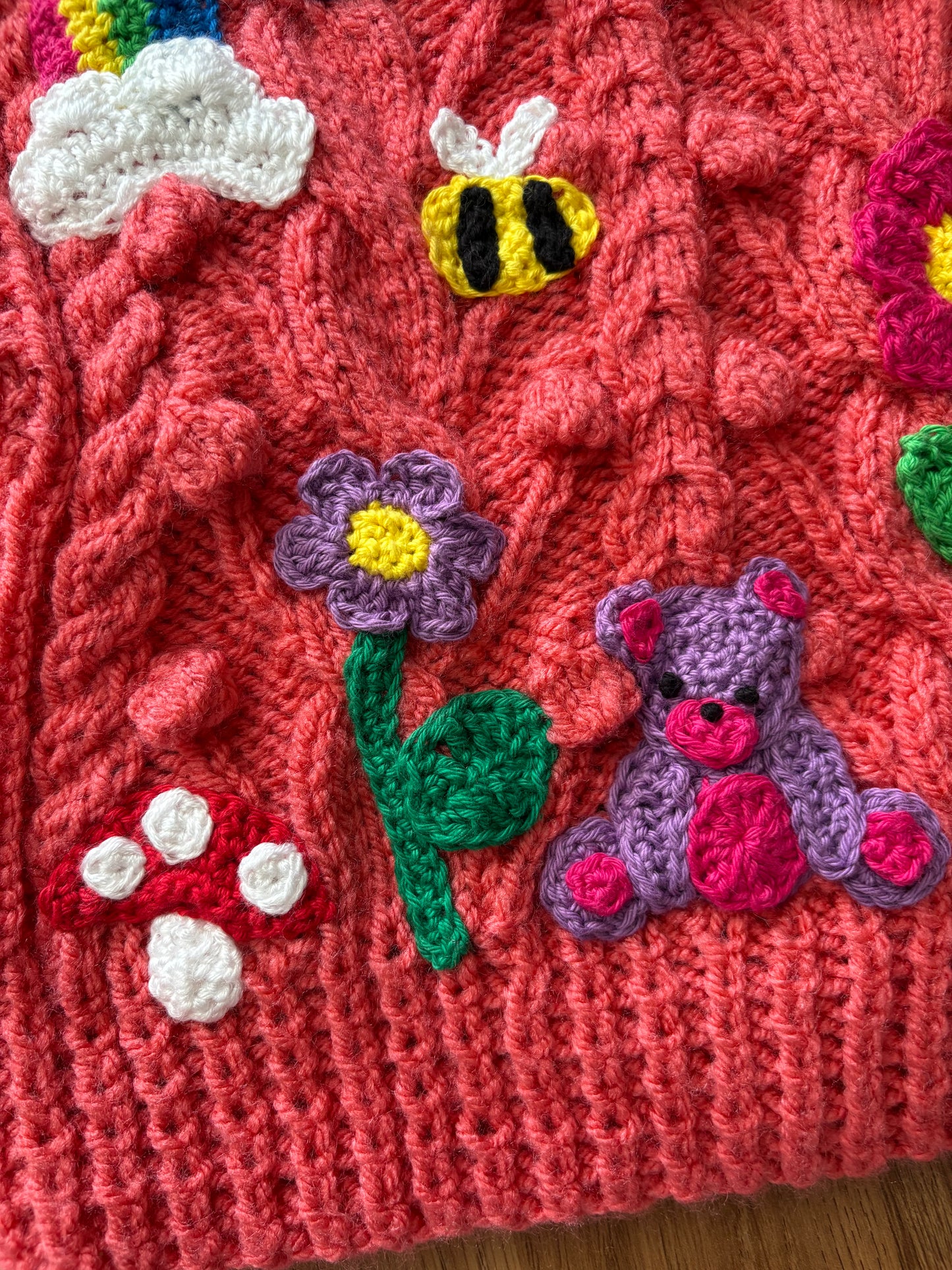 Pre-made Knitted Pink Popcorn Cardigan with flowers, rainbows, star, cloud, bee, mushroom and bear - Size 1-2 years