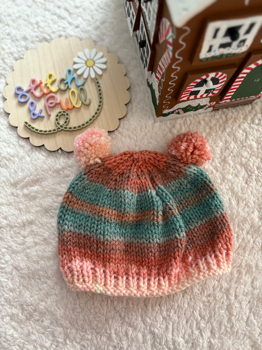 Personalisable knits - 12-18 months peach/blue/cream striped hat with 2 pom poms