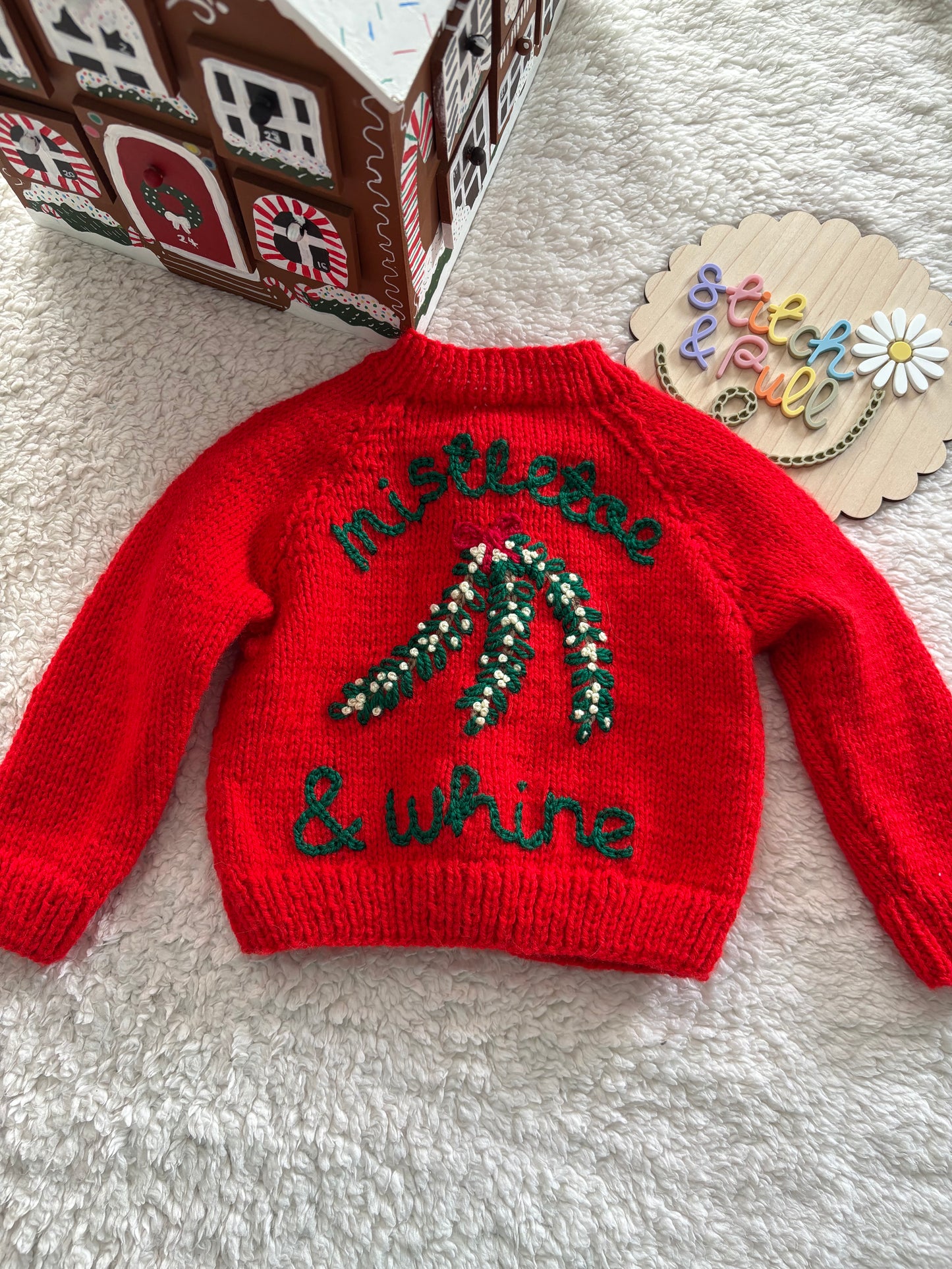 Pre-made Knitted Christmas Red Cardigan with ‘mistletoe & whine’ wording and mistletoe design - Size 3-6 months